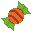 an orange and green piece of wrapped candy